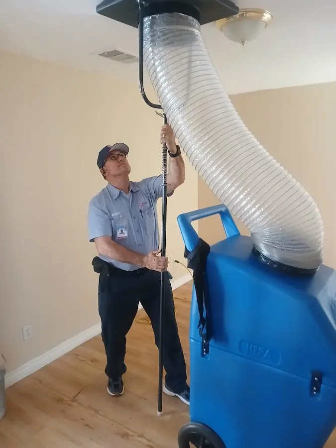 Furnace Tune-Up technician using HEPA equipment in Willow Oak
